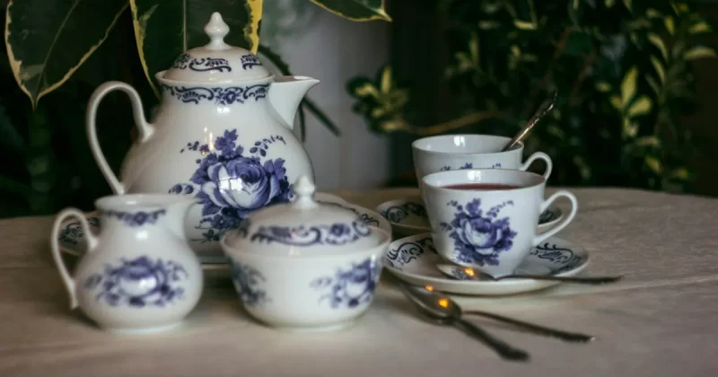 white and blue floral ceramic teacup set